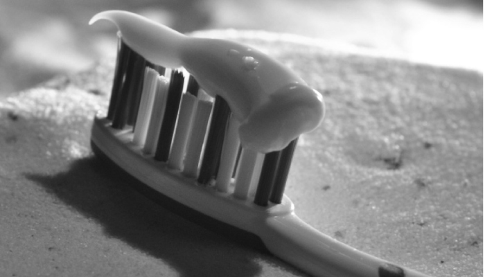 toothbrush with toothpaste closeup
