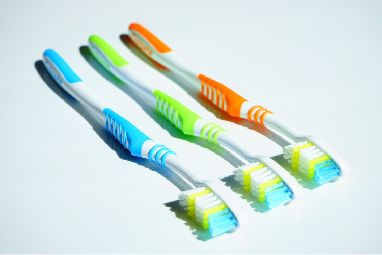 three toothbrushes