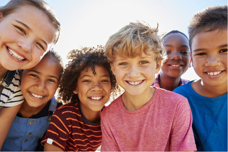 groups of kids back to school smiling after completing their dental checklist